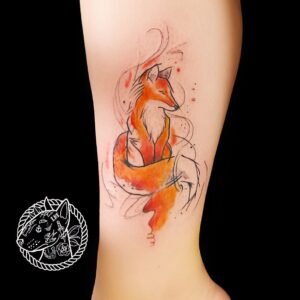 Tatouage de renard en style aquarelle sur la jambe, réalisé par Le Bull tatoué.