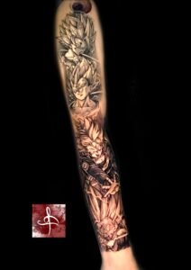Tatouage manche avant-bras inspirée manga, guerriers Saiyan style Dragon Ball, noir et gris (Rhum1 Tattoo)